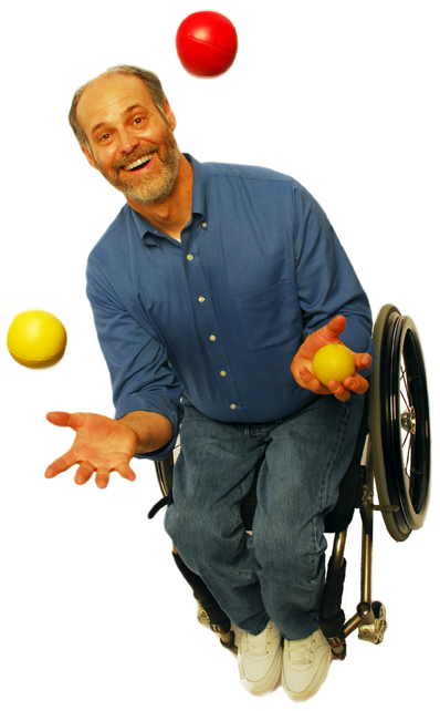 Photo of Gary Karp juggling from his wheelchair